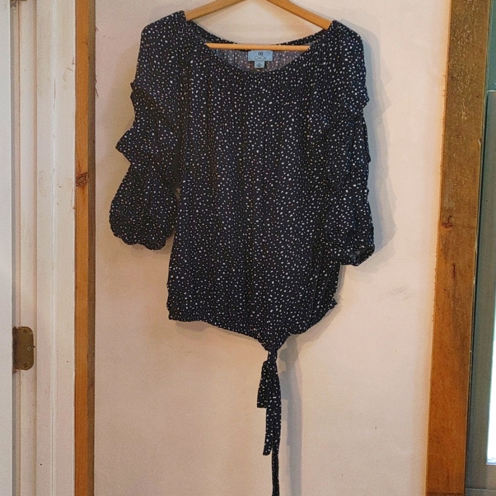 Gathered sleeve navy and polka dot blouse